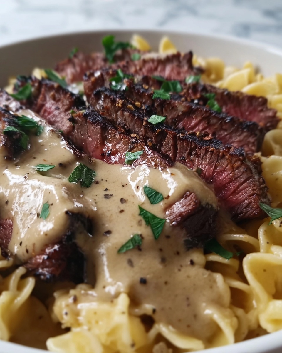 Spicy Cajun Steak with Creamy Alfredo Pasta Recipe - Recipe Image