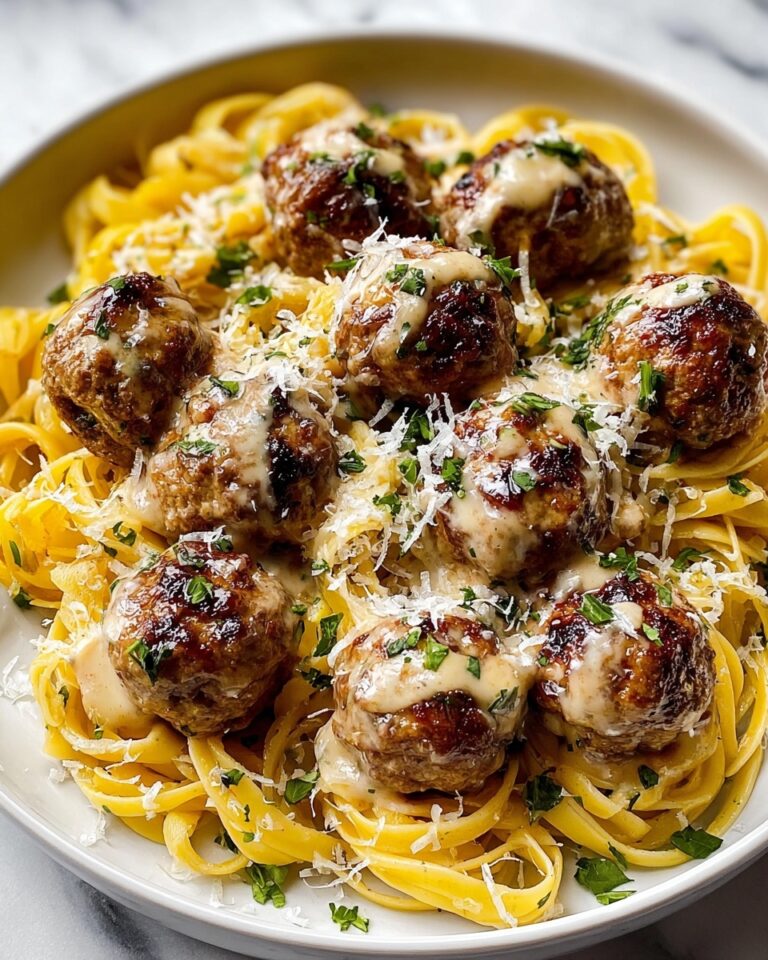 Easy Garlic Butter Meatballs Served Over Creamy Parmesan Linguine Recipe